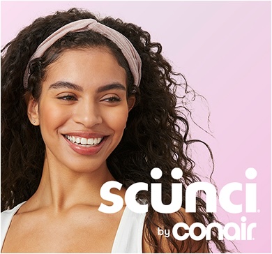 Woman wearing headband smiles against a light pink background next to the scünci by Conair logo.